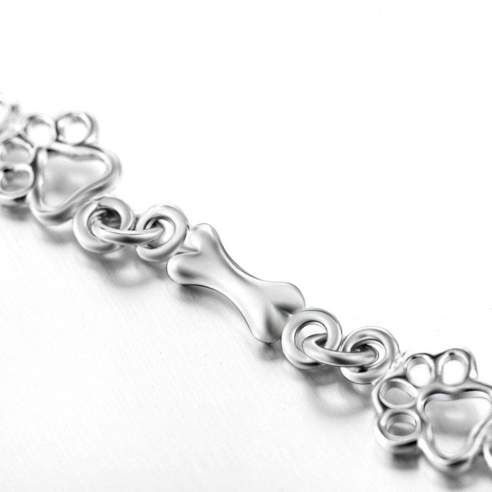 Aurembiaix™ | Paw Print and Bone Charm Bracelet in Silver
