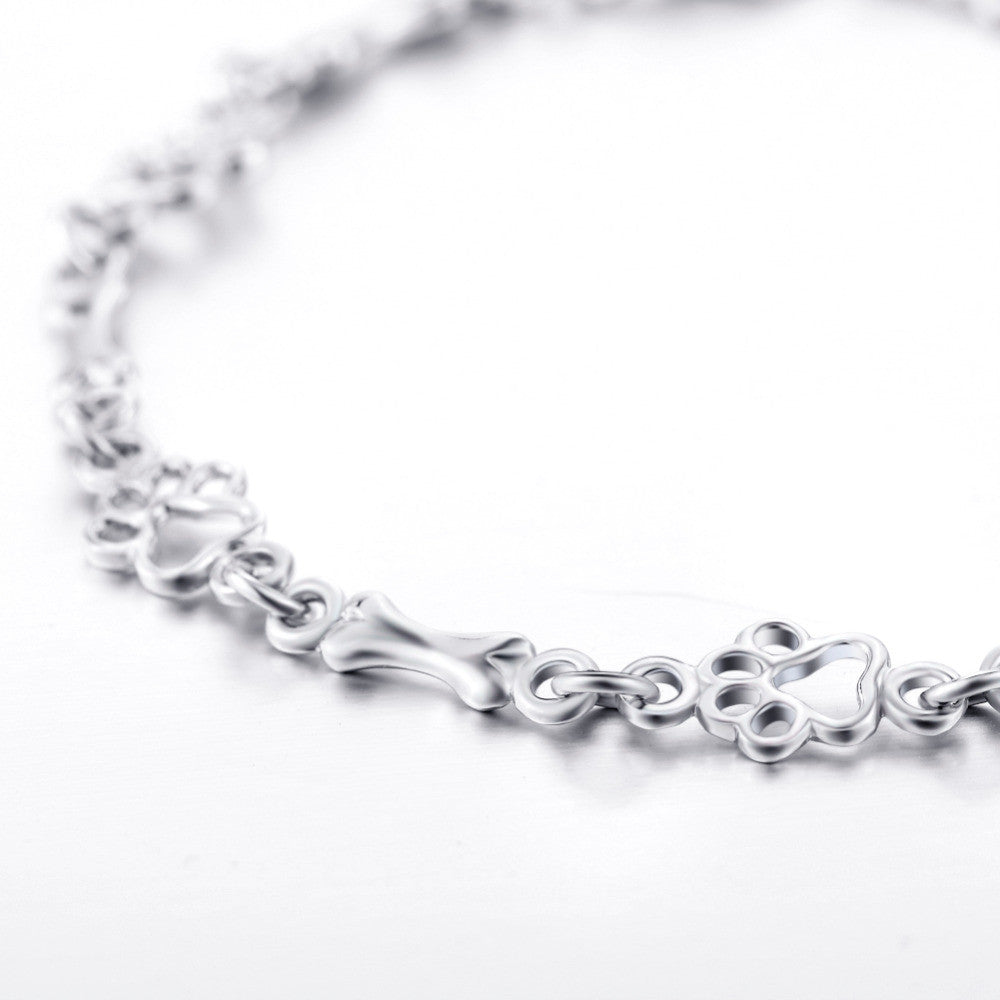 Aurembiaix™ | Paw Print and Bone Charm Bracelet in Silver