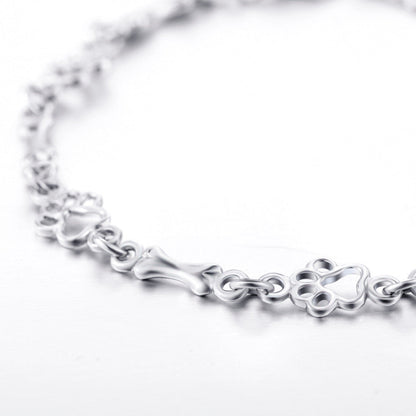 Aurembiaix™ | Paw Print and Bone Charm Bracelet in Silver
