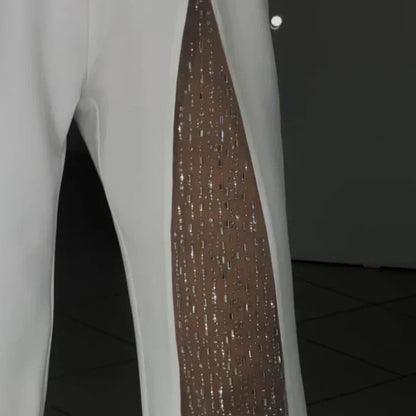 Combinaison asymétrique pour femme en maille pailletée avec haut évasé